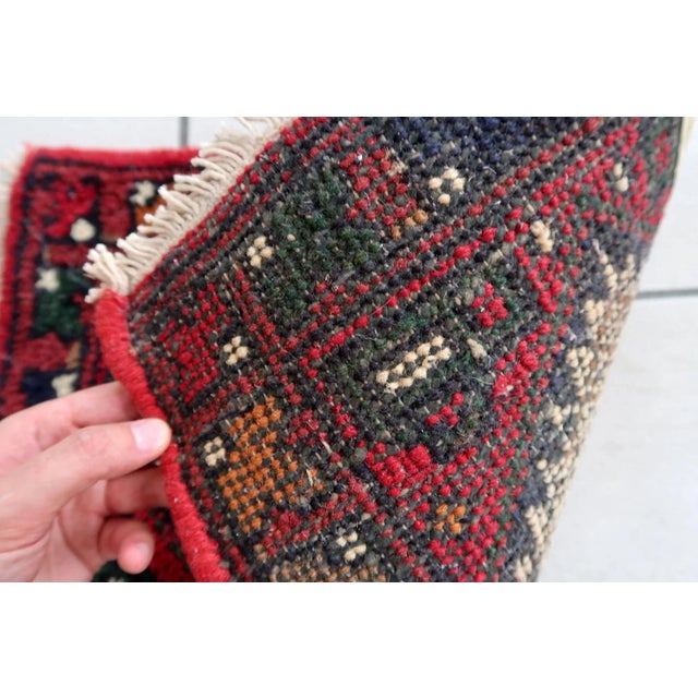 Handmade vintage Middle Eastern rug in traditional medallion design. The rug has been made in wool in the end of 20th...
