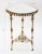 A Spanish highly decorative corner console table in brass with three legs with figural male faces and mirror top, circa...