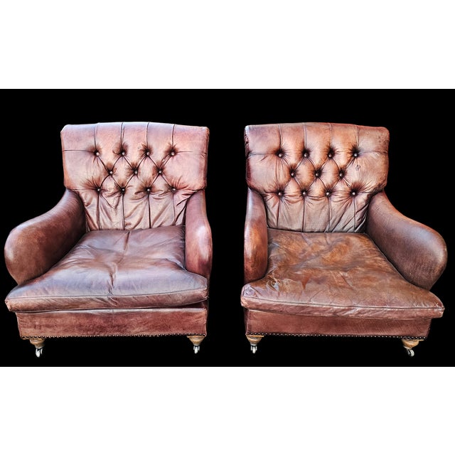 This Pair of EicholtzTufted Leather Club Armchairs ais generously proportioned with a lot of visible vintage character and...