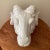 Neoclassical wall mounted Ram's Head sculpture in glazed white porcelain. This piece was made in Italy Circa 1980s
