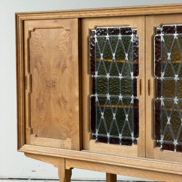 c. 1960s. Denmark. Quarter sawn oak construction with glass pane doors