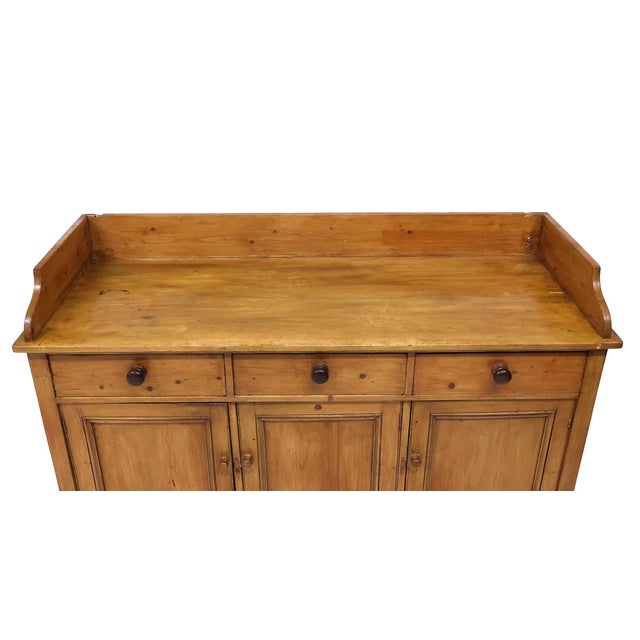 A substantial Scottish Victorian pine dresser base dating to the 19th century, retaining a particularly warm, mellow...