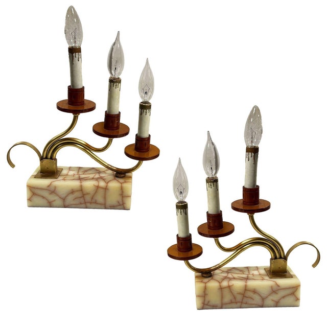 Two pairs of ornate fireplace mantles, each is a three-light candelabra white Bakelite, and brass table lamps. These...