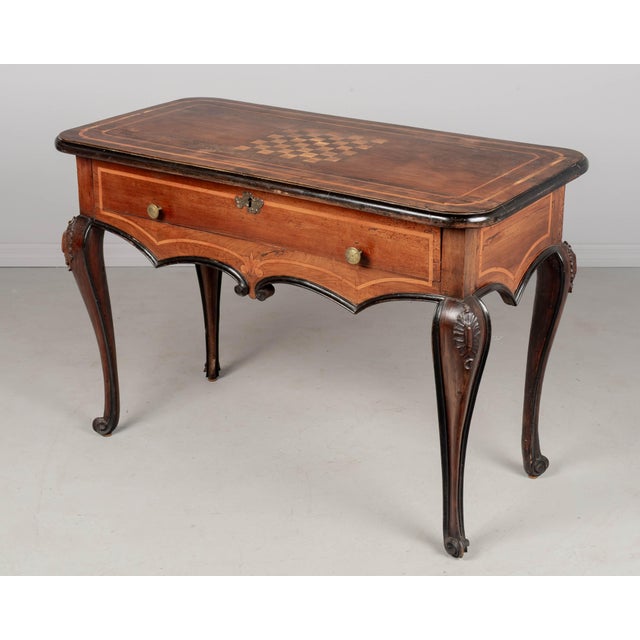An 18th century Italian Louis XV style center table or console from Torino. Bold design made from thick planks of solid...