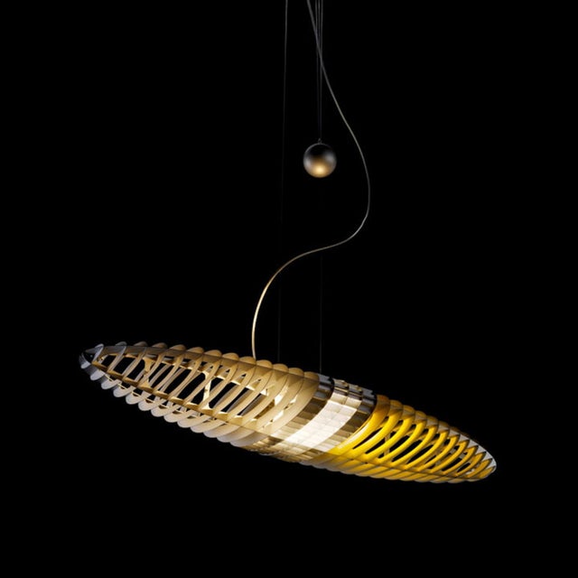 Zeppelin shaped or elliptical pendant light called Titania D17. It was designed in 1987 by Italian duo Alberto Meda &...