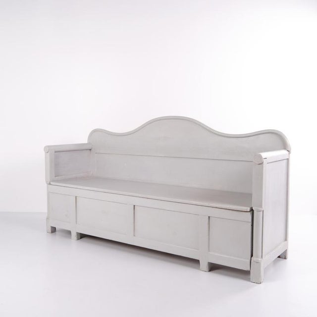 Antique Swedish bench from the 20th century, made in pine and painted grey. Classic Scandinavian design with storage space...