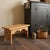 Handmade from natural pine wood, this rustic footstool features a rectangular plank top, decorative double-arched apron,...