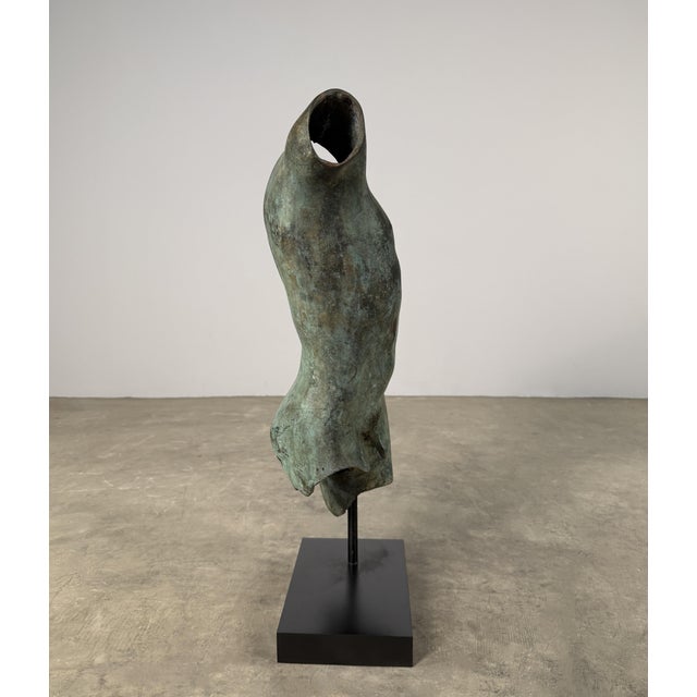 Hand cast bronze sculpture of a male torso, inspired by Greco-Roman sculpture and presented in a classical fragment form....