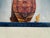 Original period front cover from the April 1934 issue of ASIA, featuring the ornately decorated stern of a traditional...