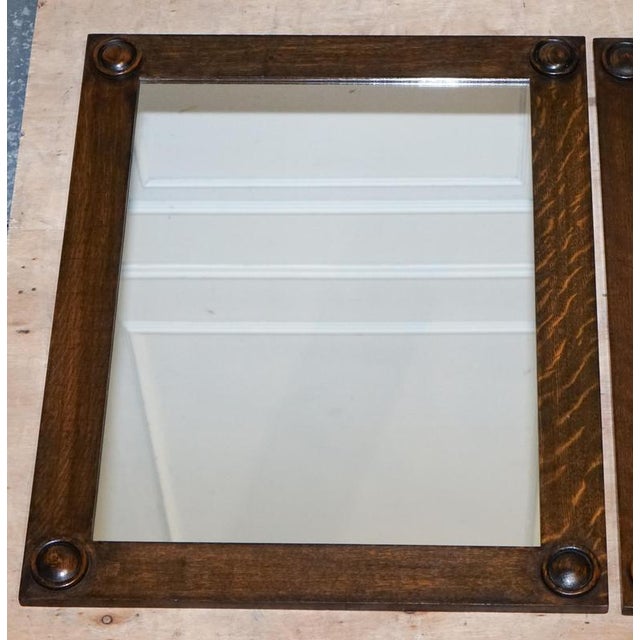 This elegant pair of rectangular wall mirrors dates to circa 1900 and is crafted in the Jacobean style, a design language...