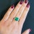 Natural 3.76 Carat Colombian Emerald with Trilliant Cut Diamond Side Stone 3-Stone Ring in 18K Gold. Complete with GRS and...