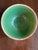 Vintage 1920s Hull Pottery Mixing Bowl in Green Glaze. In Excellent Condition. This is a rare antique item whose overall...
