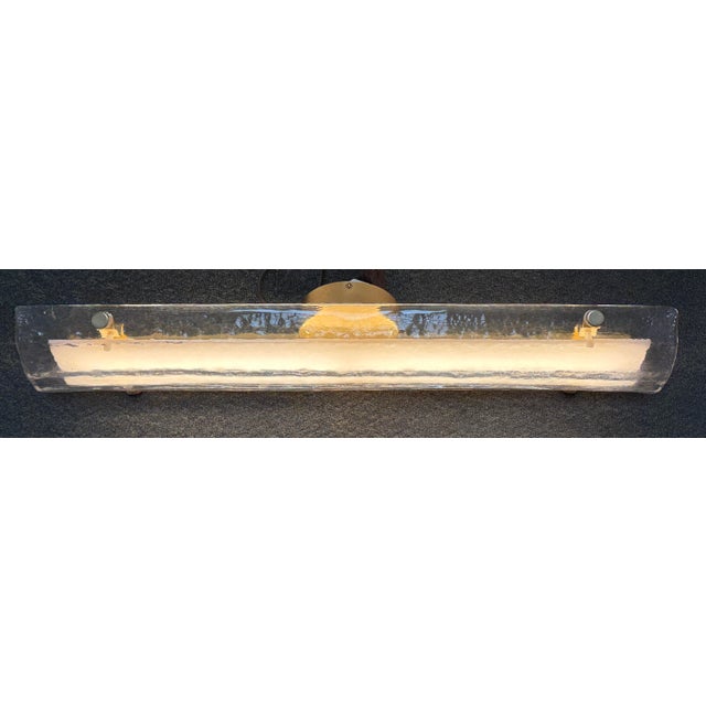 Design Plus Gallery presents the Willamette LED Sconce from Rejuvenation. The elongated, curved glass shade has a rippled...