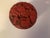 A beautifully carved Chinese cinnabar lacquer box featuring intricate floral and scroll motifs in classic deep red...