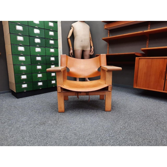 A charming oak armchair with original leather seat and backrest by Borge Mogensen. The armchair was purchased by the...