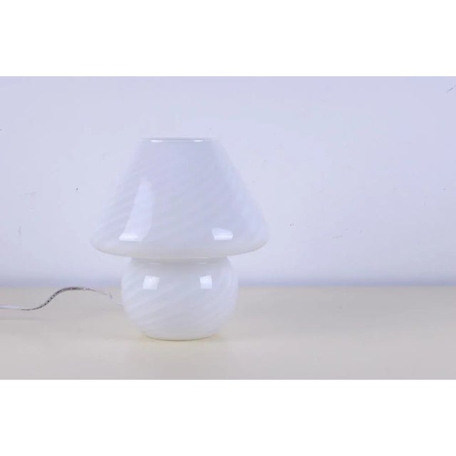 Wonderful table/bedside table lamp. Made of worked Murano glass, mushroom-shaped, spiral decoration in shades of white....