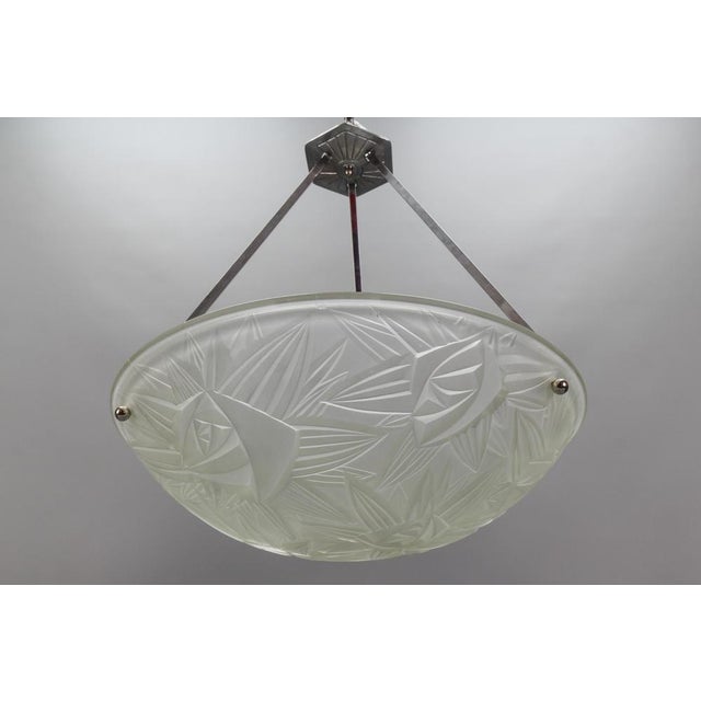 - French Art Deco pendant light with frosted white glass lamp shade/bowl by Jean Noverdy, circa the 1930s. - This...