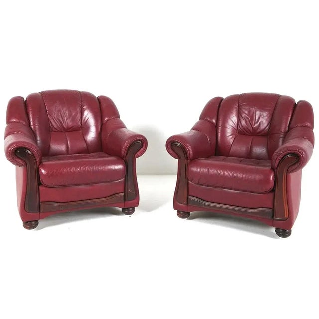 A very good pair of Scandinavian mid century transitional period vintage leather lounge chairs. The chairs have a very...