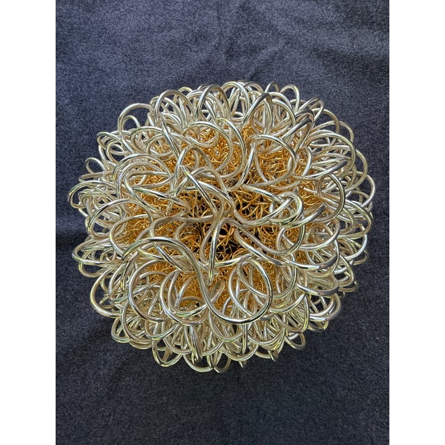 Large, heavy mixed silver and gold wire wrapped sphere sculpture. Inside gold wire sphere with a thicker silver wire...