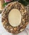 Vintage Palm Beach Style Petite Oval Shell Encrusted Table Mirror With Easel Back MAKER'S MARK: None present ORIGIN:...