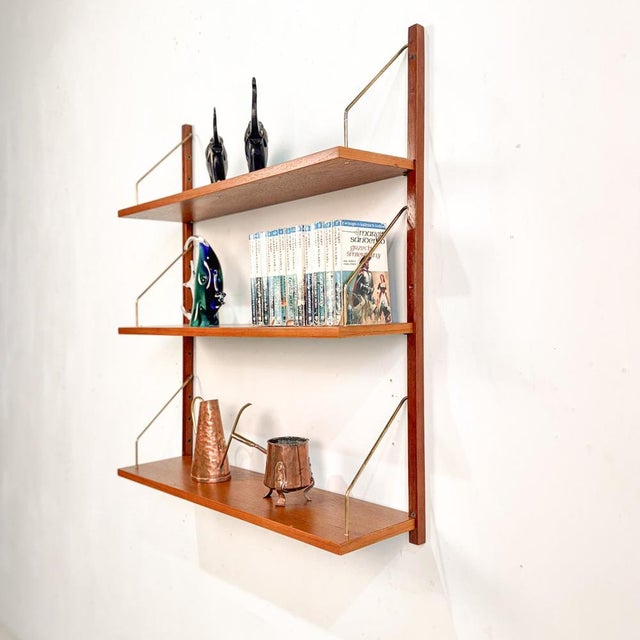 A set of three teak shelves designed in the style of wall units by p. Sorensen or poul cadovius in the 60s. These simple...