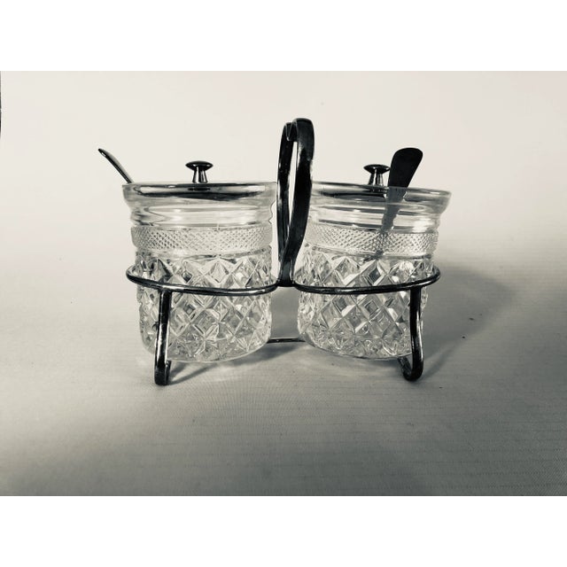 Vintage cut glass and silver plated condiment caddy includes " 2 silver spoons, 2 silver lids , 2 glass jars and caddy" No...