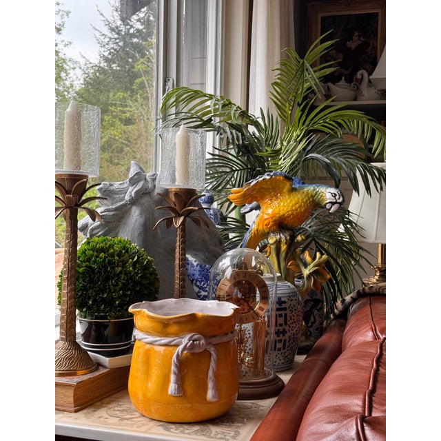 Bring a bit of sunshine to your space! Here is a vintage terra cotta painted and glazed cache pot in bright,...