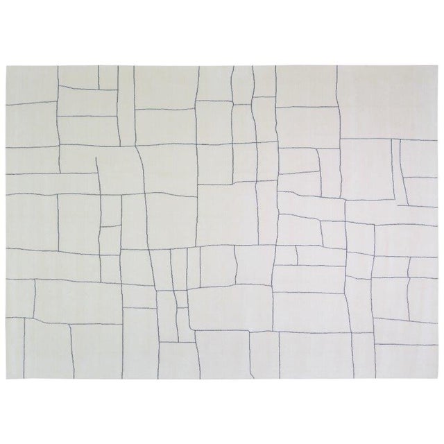 Hand-knotted with care using traditional rug-making techniques, this wool rug blends timeless craftsmanship with a modern...