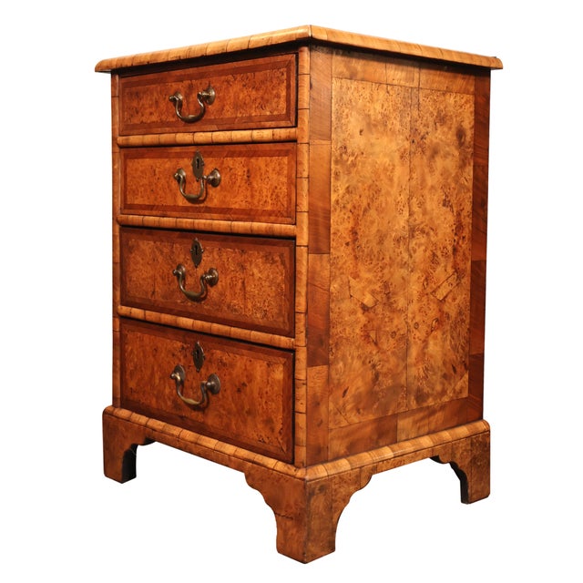 Early 20th Century Walnut Small Chest of Drawers with Yew Wood Banding. Made in England from high quality materials, this...