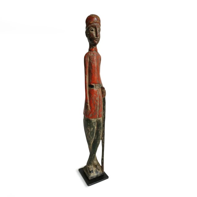Charming original old Colonial wood figure from Mali. Hand carved male guard soldier with orange uniform jacket and hat...
