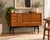 A stylish 1960s Nathan sideboard with a warm reddish-brown, tola-style wood finish and attractive grain. Featuring four...