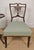 This period nursing chair has gorgeous inlaid carved features that truly highlight the craftsmanship of the Edwardian era....