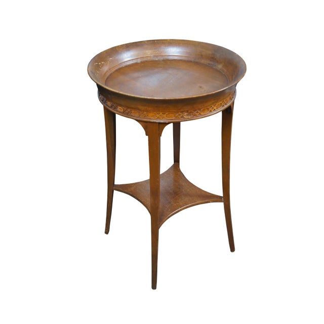 Vintage 20th century Regency style side table featuring a round top with a deep recessed surface, oval and diamond...