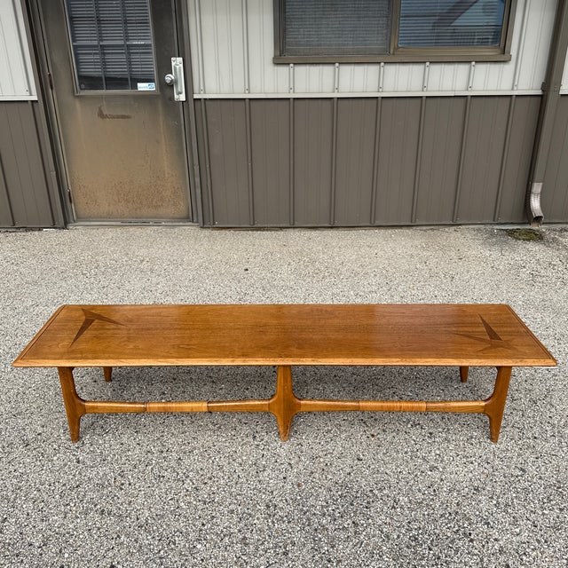 A mid-century modern standout from Lane’s iconic Constellation collection. Featuring a long, sculpted walnut top, tapered...