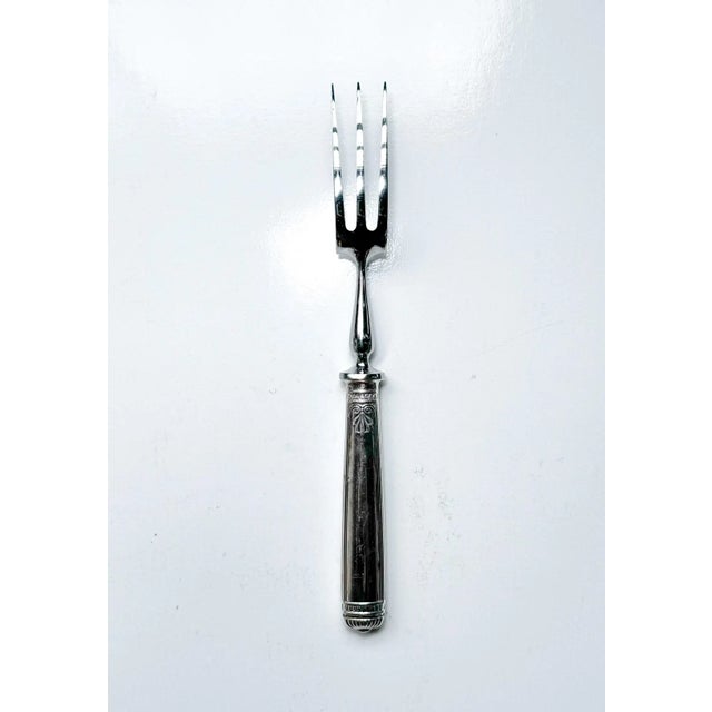Elegant Christofle France silver-plated serving fork • Measures approximately 11 inches in length • Features a richly...