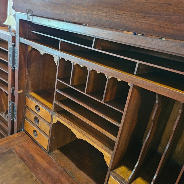 Striking Victorian Wooten walnut standard grade desk. 2 Large paneled doors swing out to reveal center piece with drop...