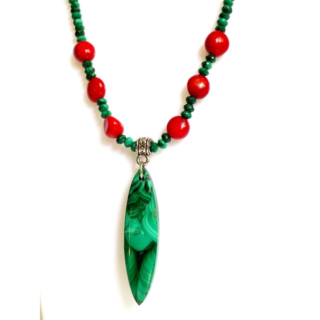 Elevate your collection with this striking, one-of-a-kind necklace featuring genuine natural malachite—a rare and highly...