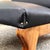 Large low armchair with a wooden frame and leather seat in the style of Jens Risom, 1950s. The design is clearly inspired...