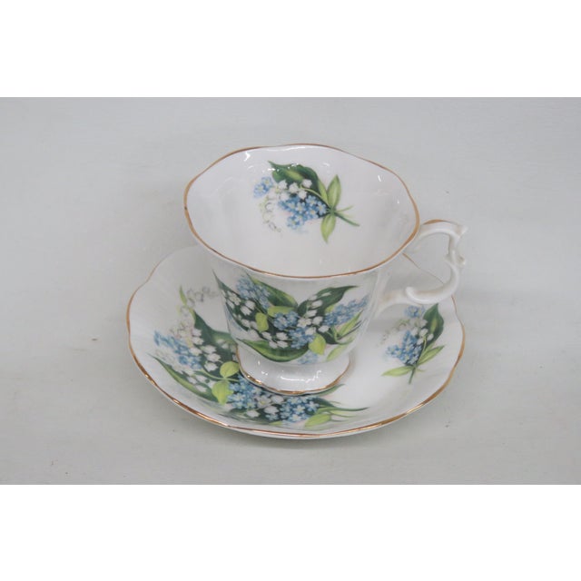 This lovely tea cup is made of bone china. This set is stamped as being made by Royal Stafford in England, lily of the...