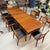 A generously scaled Danish dining table in richly grained teak, built with the restrained architectural vocabulary that...
