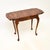 A smart and interesting antique figured walnut occasional side table. This was made in England, it dates from around the...