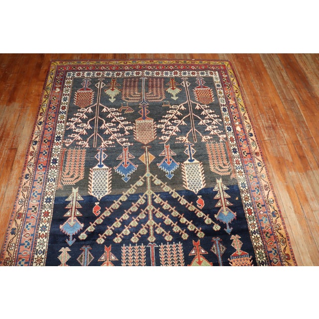 An Early 20th-century Tribal Persian Bakhtiari rug in rare gallery format with a weeping willow tree all over design...