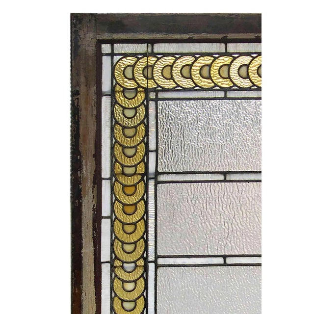 Antique, early 20th century skylight of textured, translucent, and stained glass. This large-scale window has a geometric...