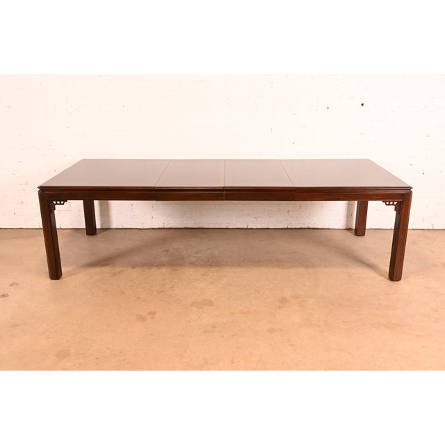 An exceptional Chippendale or Hollywood Regency style extension dining table By Drexel USA, Circa 1980s Gorgeous book-...