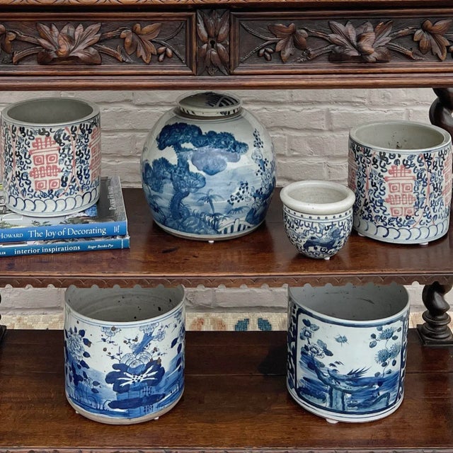 Handmade blue and white porcelain planter with an antiqued finish. This planter is hand-painted with a beautiful scenic...