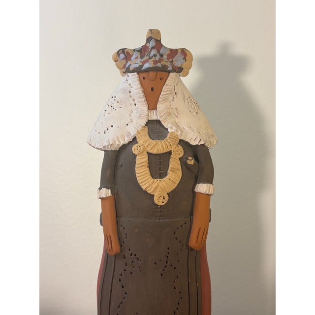 Vintage Spanish folk art woman. Sculpted from clay then baked and hand painted. Sculpture is of some prominent woman,...