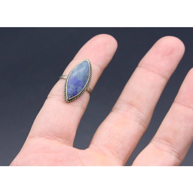 This eye catching Vintage Afghan Marquise Lapis Lazulli Silver Ring is sure to garner lots of oohs and aahs when worn. The...