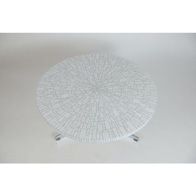 Round mosaic coffee table by Heinz Lilienthal from the 1970s. The table top consists of an artistic mosaic of white...