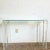 Explore the cutting-edge design of the Postmodern era with this Bolted Lucite and Inlaid Glass Top Console Table. This...