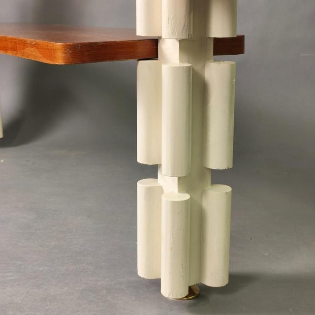 A distinctive sculptural bookcase, likely handcrafted, featuring a futuristic Italian design from the late 1960s. Fully...